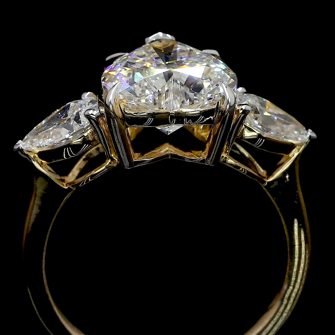 HEART SHAPED RING WITH 2 PEAR SHAPED SIDE DIAMONDS