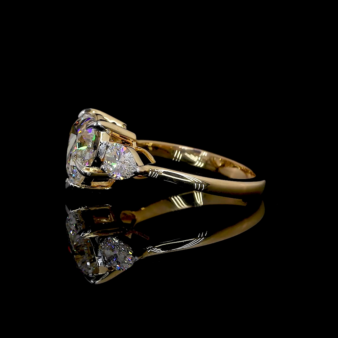 HEART SHAPED RING WITH 2 PEAR SHAPED SIDE DIAMONDS