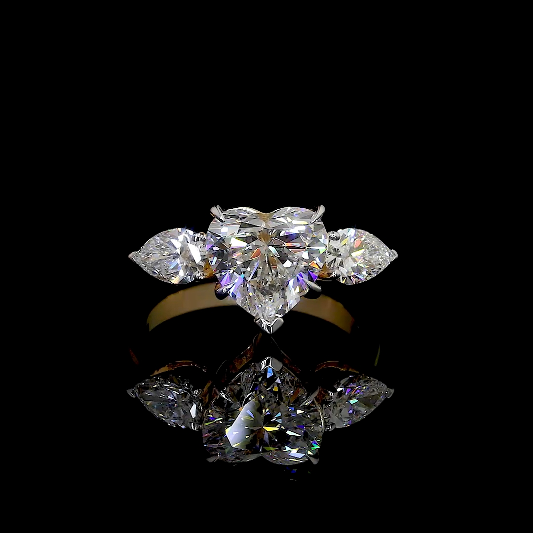 HEART SHAPED RING WITH 2 PEAR SHAPED SIDE DIAMONDS