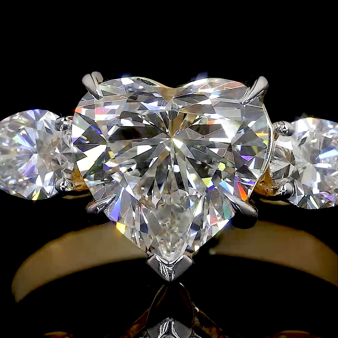 HEART SHAPED RING WITH 2 PEAR SHAPED SIDE DIAMONDS
